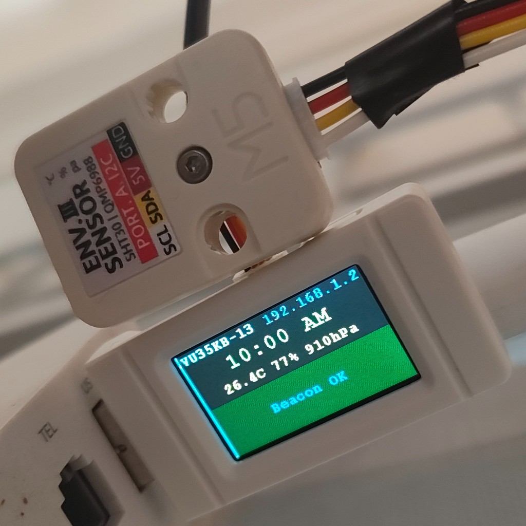 ESP32-S3 Geek with M5Stack ENV III sensor module. The display shows live shack readings and VU35KB-13 beacon status.